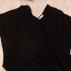 Francesca’s black baggy shirt